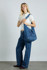 denim sling bag with pocket detail