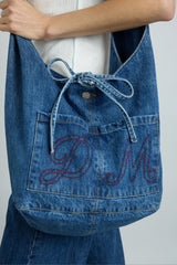 denim sling bag with pocket detail
